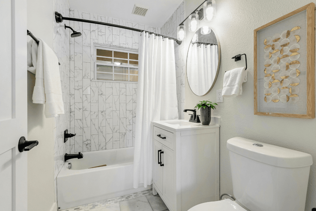 Bathroom exhaust fan replacement with clean white design and tile walls